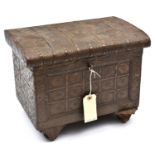 A sheet copper covered rectangular casket, the sides and rounded lid embossed overall with small