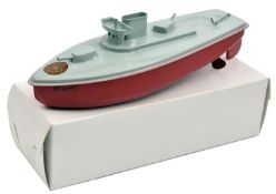 A very late issue Sutcliffe tinplate clockwork SNAPPY Naval gun boat. In light grey and red
