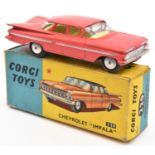 A Corgi Toys Chevrolet Impala (220). In salmon pink with lemon interior. Boxed, some wear. Vehicle