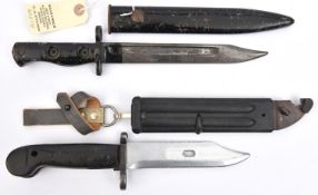 A ML1A3 bayonet, in scabbard, and a Soviet Dragunov wire cutter bayonet in scabbard with belt
