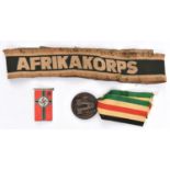 An Afrikakorps woven cuff title (very worn), an Axis medal for the Campaign in North Africa, with