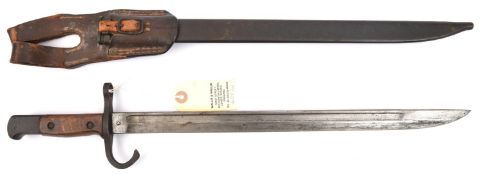 A Japanese type 30 Arisaka bayonet, with Tokyo arsenal mark, in its scabbard with leather frog.