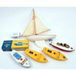 4x Sutcliffe tinplate boats. 2x Comet speedboats in yellow. A Tiger speedboat in blue and white.