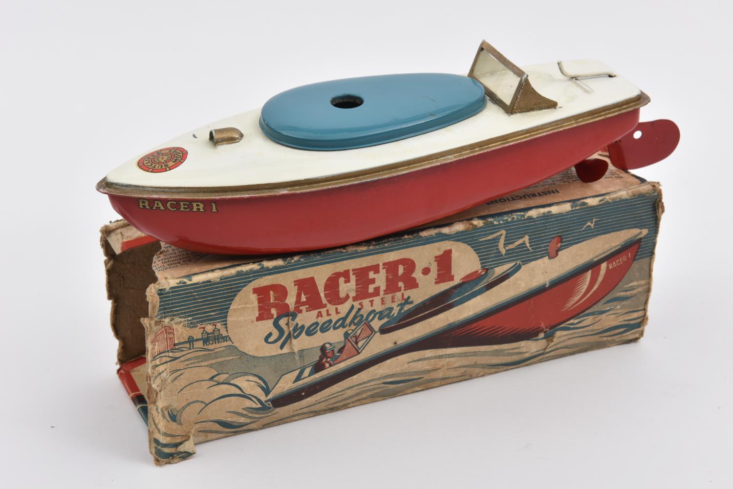 A very early issue Sutcliffe tinplate clockwork RACER 1 speed boat. In ...