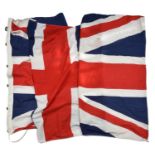 A large Union flag, 4feet 6 in x 9ft 6in, with cord and toggle. GC