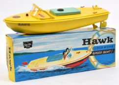 A Sutcliffe clockwork tinplate HAWK speed boat/motor launch. In yellow with green hatch, complete