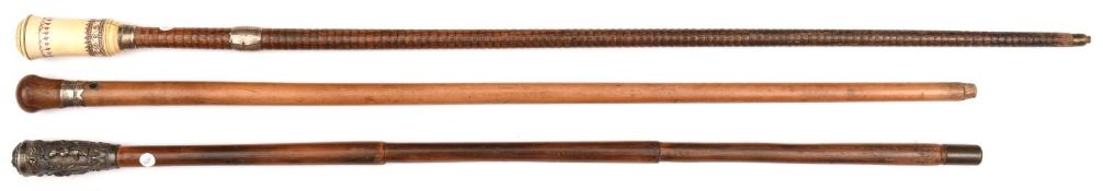A malacca walking cane, darkwood knopped grip, with silver coloured band, and pierced for wrist