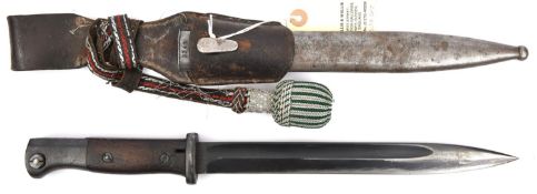 A Third Reich period K98 bayonet, with maker's code “S/172.G” and wooden grips, in its non