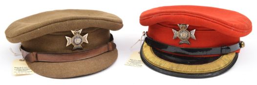 An officer's scarlet peaked cap, with enamelled ERII Maltese Cross badge of The Light Dragoons,