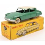 A French Dinky Toys Citroen DS19 (24C). In green with white roof and spun convex wheels with white