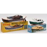 2x Tri-ang clockwork plastic boats. A Motor Lifeboat in RNLI livery, complete with rudder and