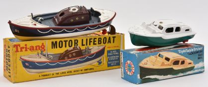 2x Tri-ang clockwork plastic boats. A Motor Lifeboat in RNLI livery, complete with rudder and