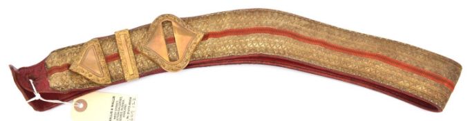 An officer's gilt lace shoulder belt of the Army Ordnance Corps, scarlet central stripe and