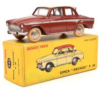 A French Dinky Simca Aronde P.60 (544). In brick red, with silver side-flash and pinkish cream roof.