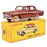 A French Dinky Simca Aronde P.60 (544). In brick red, with silver side-flash and pinkish cream roof.