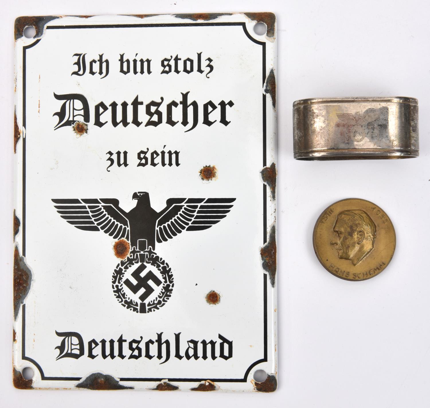 A silver plated oval WM napkin ring, lightly impressed with eagle and swastika flanked by the