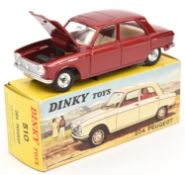A French Dinky Toys Peugeot 204 (510). In metallic dark red, with cream interior and spun concave