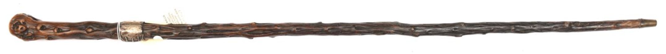 A knotted darkwood walking cane, made in 3 sections, the junction of rootwood grip and haft