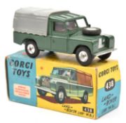 A Corgi Toys Land Rover (438). In dark green with grey tilt and red interior. Boxed, minor wear.