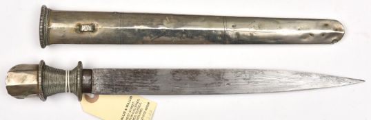 A Tibetan knife, forge welded blade 10½”, the hilt of WM with octagonal pommel and wire bound