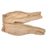 A pair of WWI period US Army riding breeches, brass buttons to flies and waist marked “US Army”,