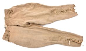 A pair of WWI period US Army riding breeches, brass buttons to flies and waist marked “US Army”,
