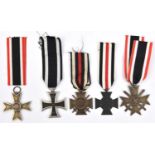 A 1914 Iron Cross 2nd class, (suspender ring repaired); 1914-18 Honour Cross with swords; another,