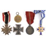 5 Third Reich medals: 1939 Iron Cross 1st class, with maker's mark “107” in rectangle on the pin (