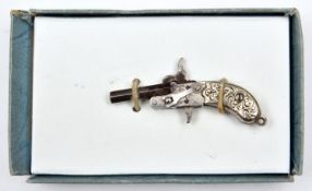 A silver plated miniature watch chain pinfire pistol, tip down barrel, cocking hammer and trigger,