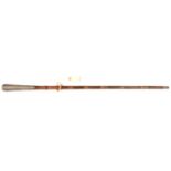 A smoothed bamboo walking cane, long flared Eastern silver grip 7” embossed overall with scrolled