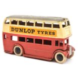 A rare 1930's Dinky Toys Double Decker Bus (29c). An example with cream upper and red lower body,