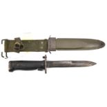 A US M8A1 bayonet, in its khaki composition scabbard with webbing belt loop. GC