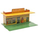 A Dinky Toys Filling and Service Station (48). A tinplate station with green base, yellow roof and