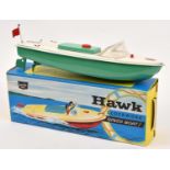 A Sutcliffe clockwork tinplate HAWK speed boat/motor launch. In white and green, complete with