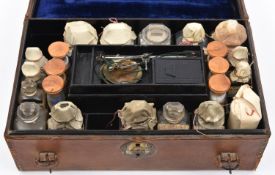 A late 19th Century English travelling apothecary set by the chemists Savory & Moore. A leather
