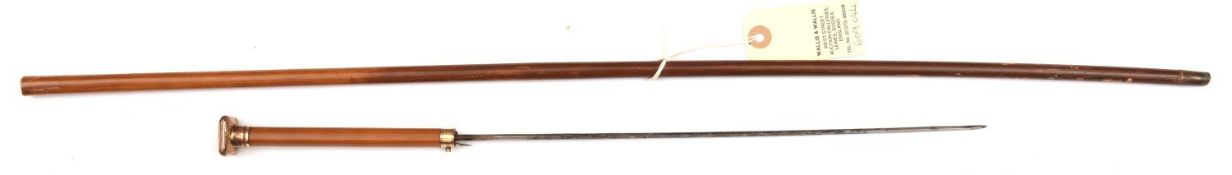 A slender late 19th century dagger cane, gilt square cap pommel engraved with script monogram “MCS”,