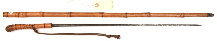 A late 19th century bamboo sword cane, slender SE fullered blade 21½”, engraved rootwood pommel, the