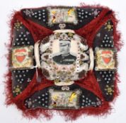 A Boer War pin cushion, in the form of Maltese Cross with studded charcoal grey panels edged with