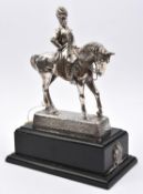 A silver plated equestrian figure of General Buller, in full dress, on simulated darkwood plinth,