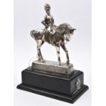 A silver plated equestrian figure of General Buller, in full dress, on simulated darkwood plinth,