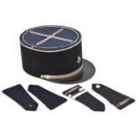 A French officer's black cloth kepi, silver braid top ornament, silver lace above leather peak, with