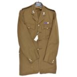 An officer's khaki 4 pocket tunic, with ERII Lt Colonel The Light Dragoons insignia, plain