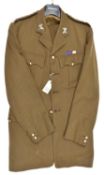 An officer's khaki 4 pocket tunic, with ERII Lt Colonel The Light Dragoons insignia, plain
