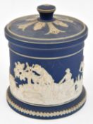 A Staffordshire jasperware pot by William Adams of Tunstall. A lidded pot in blue and white with