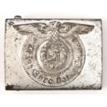 A Third Reich silver painted steel SS belt buckle, the back stamped with RZM mark, “155/43” and SS
