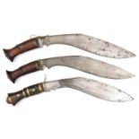 2 similar military style kukris, blades 12½”, steel mounted darkwood grips with slender lozenge