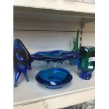 Five pieces of blue glass