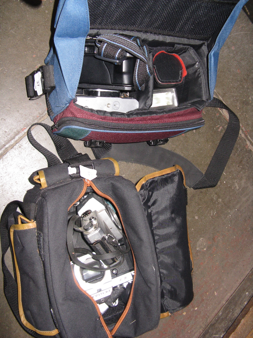 2 camera bags with cameras and accessories