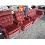 A 4 piece G-Plan retro rust coloured suite with reclining armchair.
