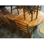 A pine dining table and 4 ladder bak chairs